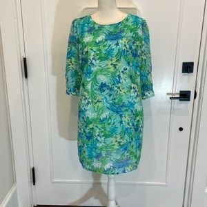 Bright green, blue, yellow dress.